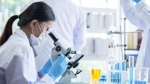 Scientist analyzing research related to Mitolyn